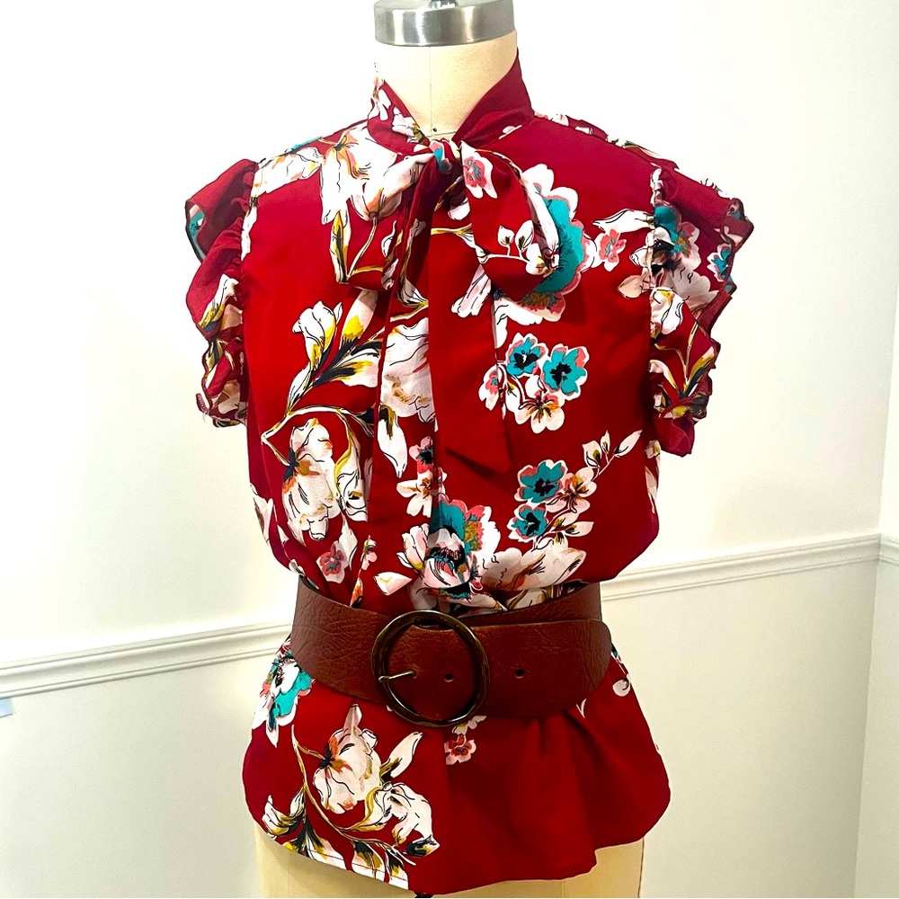 Red flower print ruffled sleeveless blouse with large bow tie at neck